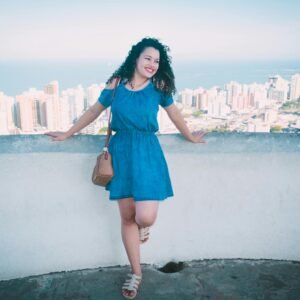 Smiling Woman Standing on Rooftop